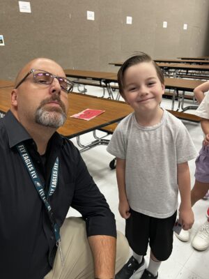 Welby elementary student and adult.
