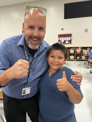 Welby elementary student and adult.