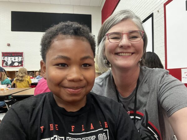 Welby elementary student and adult.