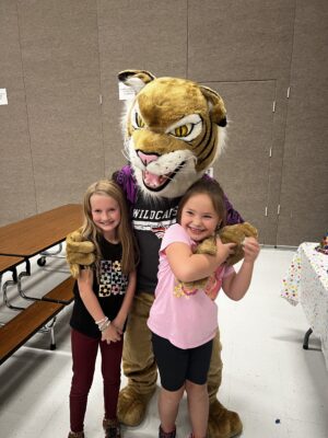 Welby elementary students and mascot.